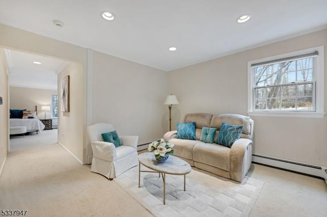 living area featuring light carpet, recessed lighting, a baseboard heating unit, and ornamental molding