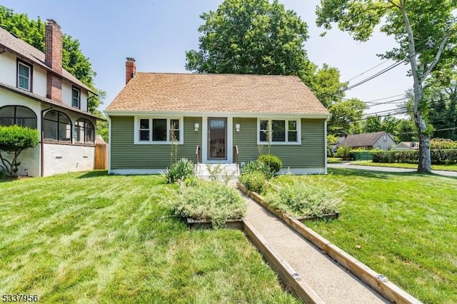 view of front of house with a front lawn