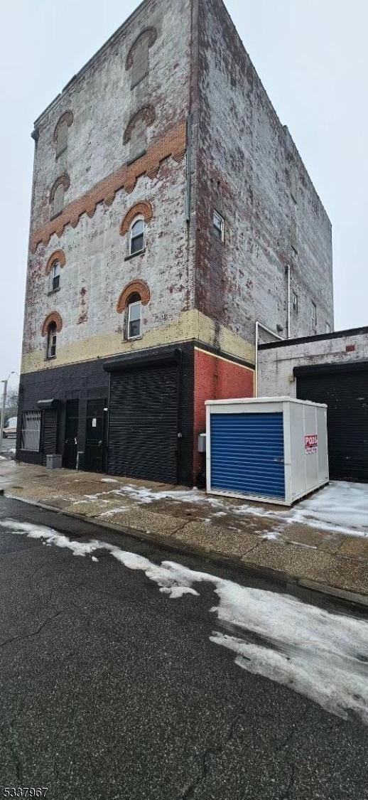 view of building exterior featuring central air condition unit