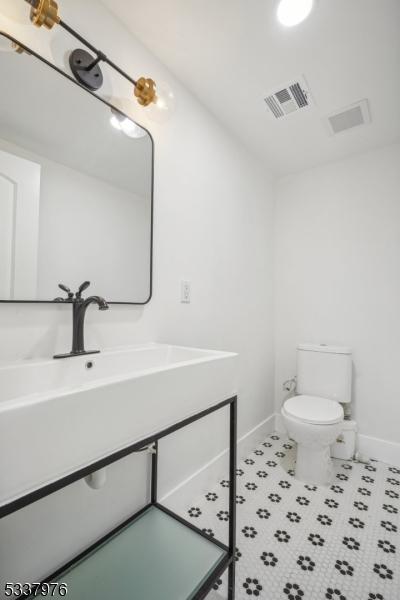 bathroom with sink and toilet