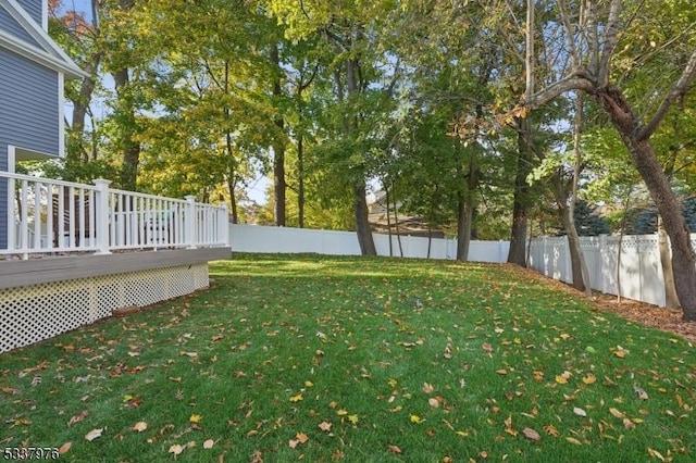 view of yard featuring a wooden deck