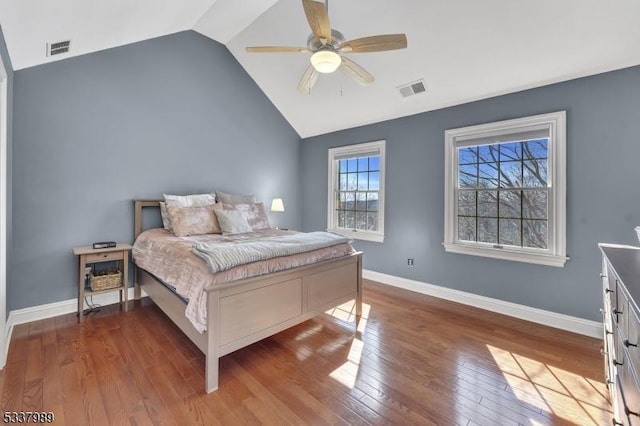 bedroom featuring visible vents, baseboards, and hardwood / wood-style flooring