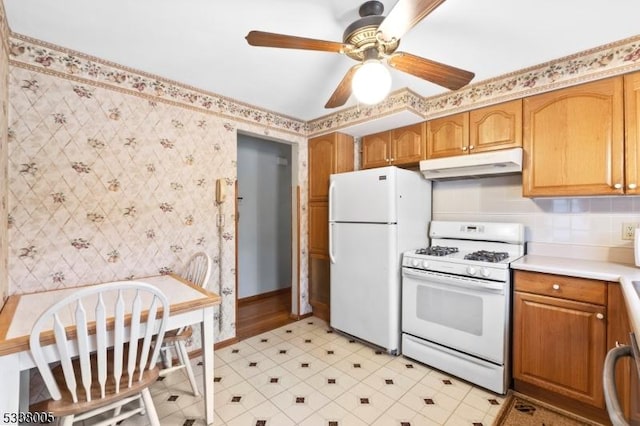 kitchen featuring ceiling fan and white appliances