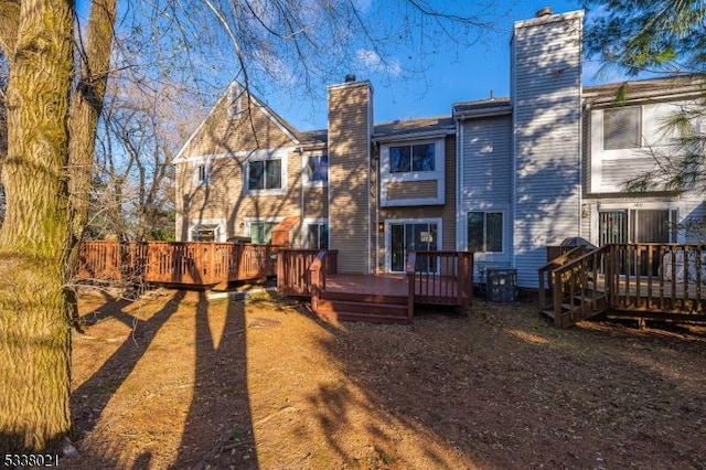 back of property featuring a wooden deck