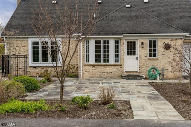 94 Brookville Hollow Rd, Delaware Twp, NJ 08559 - rear view of property with brick siding, a shingled roof, and a patio