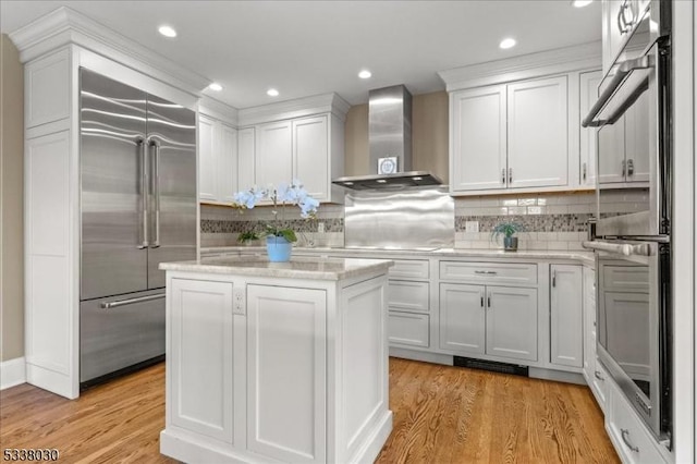 94 Brookville Hollow Rd, Delaware Twp, NJ 08559 - kitchen featuring wall chimney exhaust hood, appliances with stainless steel finishes, and white cabinetry