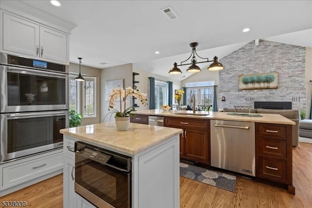 94 Brookville Hollow Rd, Delaware Twp, NJ 08559 - kitchen with a kitchen island with sink, stainless steel appliances, visible vents, and a sink