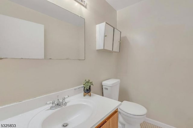 half bath with vanity and toilet