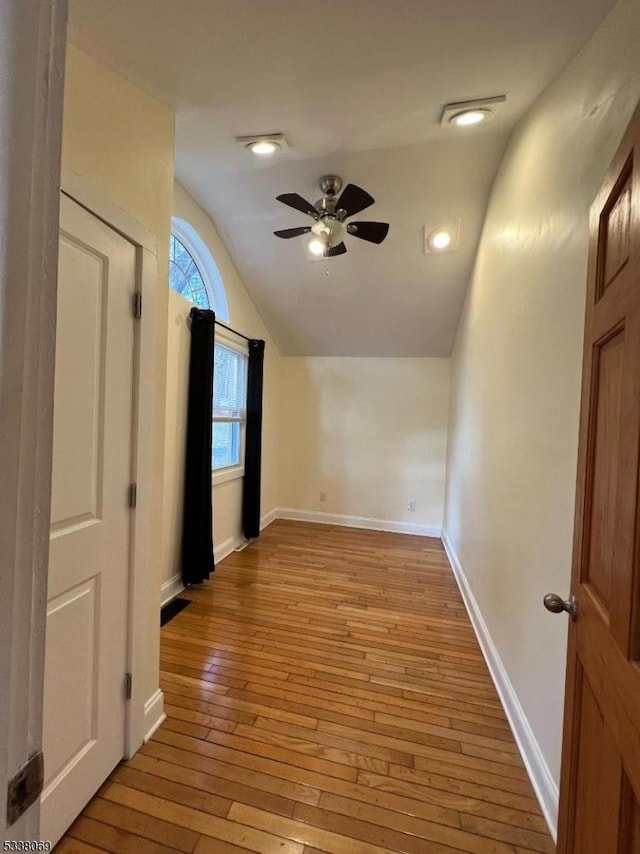 interior space with lofted ceiling and light wood-type flooring