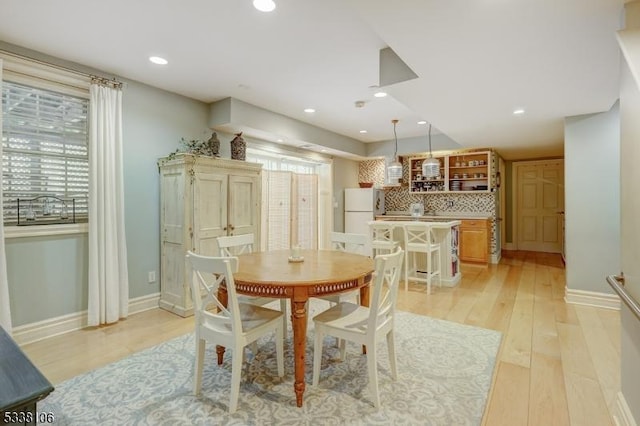 dining room featuring light wood-type flooring