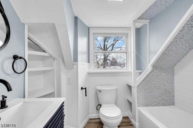 bathroom featuring hardwood / wood-style flooring, vanity, and toilet