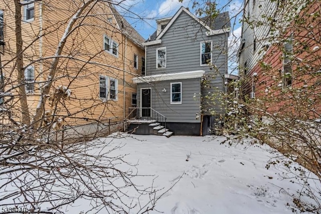 view of snow covered house