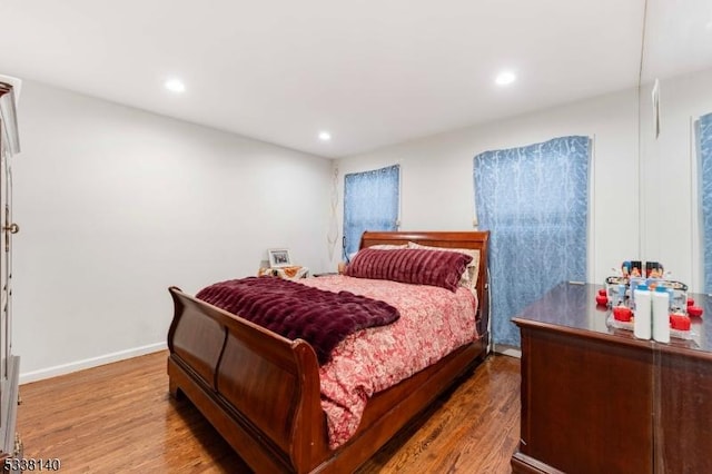 bedroom with hardwood / wood-style flooring