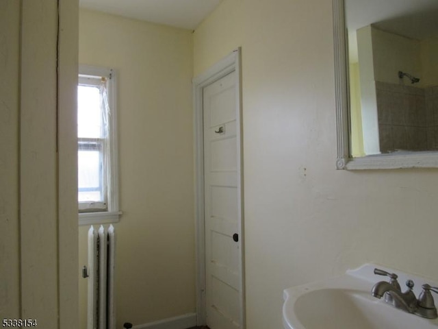 bathroom featuring sink and radiator heating unit