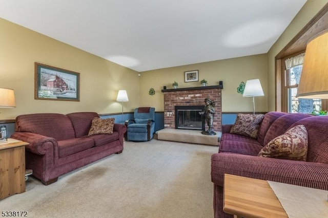 living room featuring a brick fireplace and carpet flooring