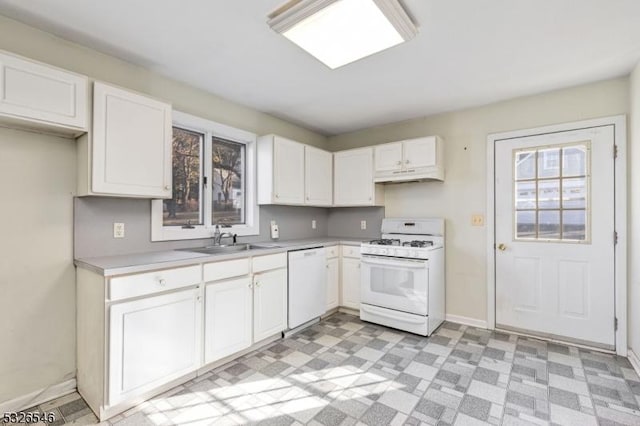 kitchen featuring sink, white appliances, and white cabinets