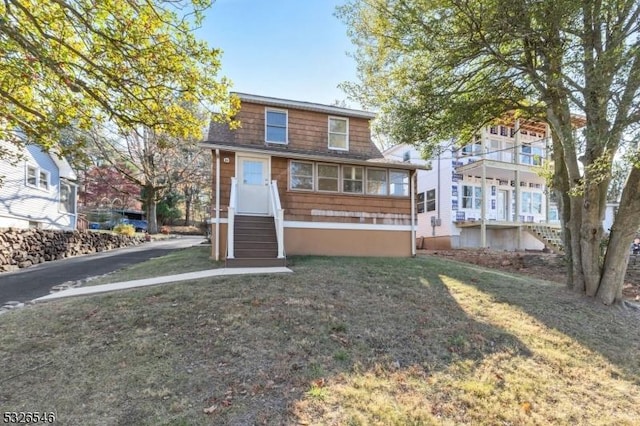 view of front of property with a front lawn