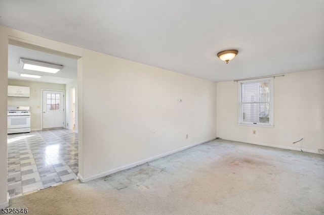 unfurnished room featuring light colored carpet