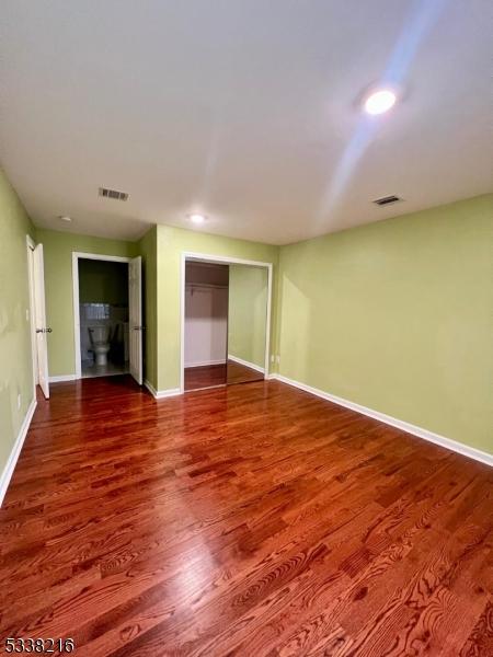 unfurnished room featuring wood-type flooring