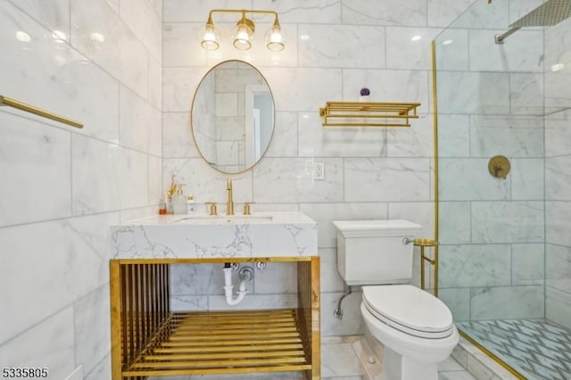 bathroom with toilet, sink, and a tile shower