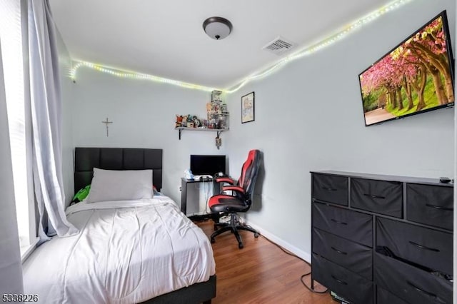 147 E Main St, Rockaway Boro, NJ 07866 - bedroom with wood finished floors, visible vents, and baseboards