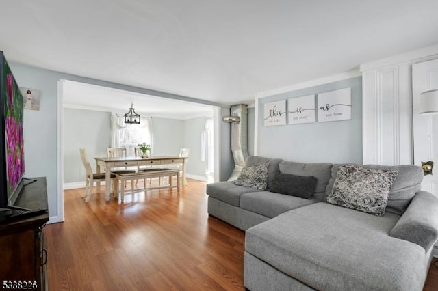 147 E Main St, Rockaway Boro, NJ 07866 - living area with an inviting chandelier, baseboards, and wood finished floors