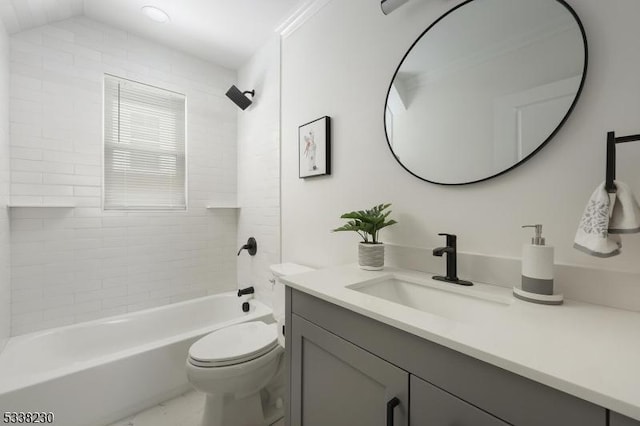 full bathroom with vanity, toilet, and tiled shower / bath