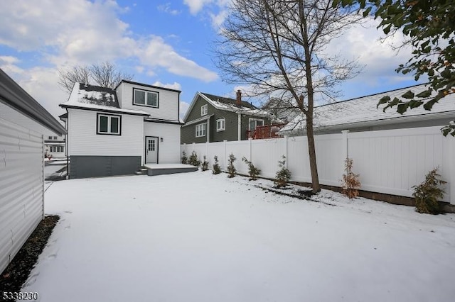 view of snow covered house