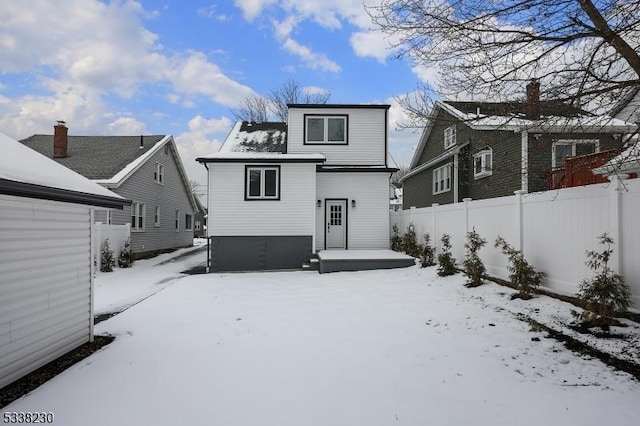 view of snow covered house