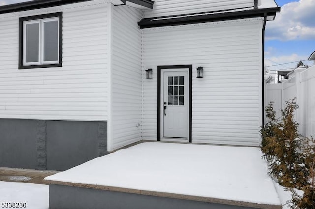 entrance to property with a patio area