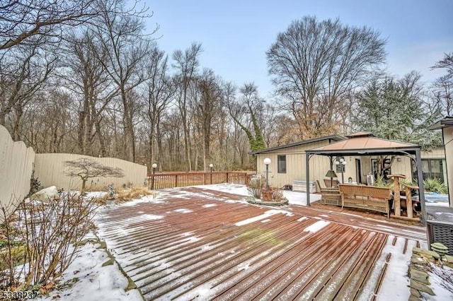 snow covered deck featuring a gazebo