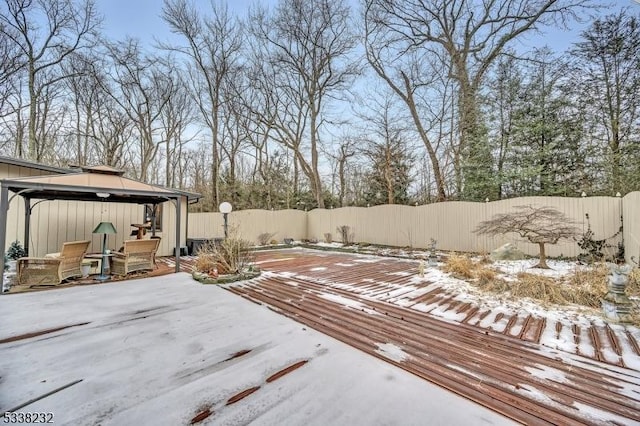 yard covered in snow with a gazebo