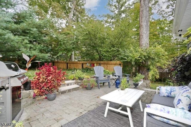 view of patio / terrace with a fenced backyard and an outdoor living space