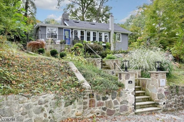 ranch-style home featuring stairs