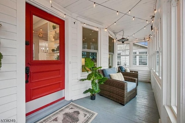 view of exterior entry featuring covered porch