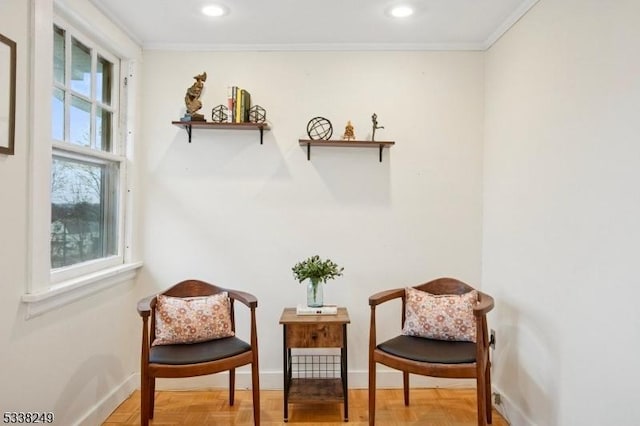 living area with recessed lighting, baseboards, and ornamental molding