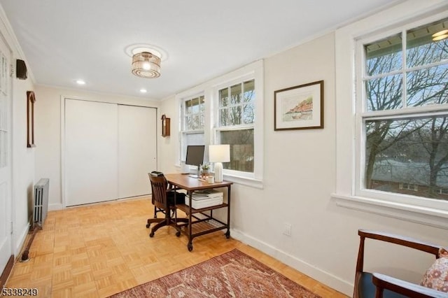 office featuring recessed lighting, baseboards, and radiator heating unit