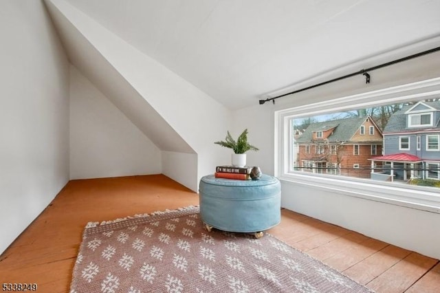 bonus room featuring vaulted ceiling