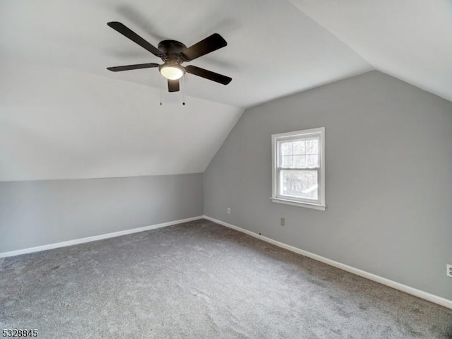 additional living space with lofted ceiling and carpet floors