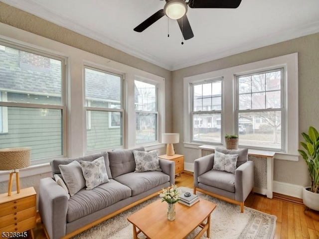 sunroom / solarium with ceiling fan