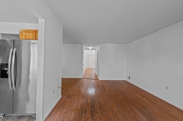 unfurnished living room with wood-type flooring