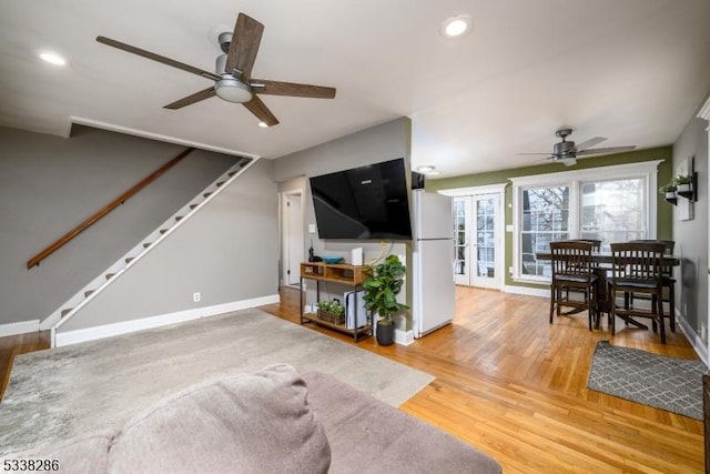 living room featuring hardwood / wood-style flooring and french doors