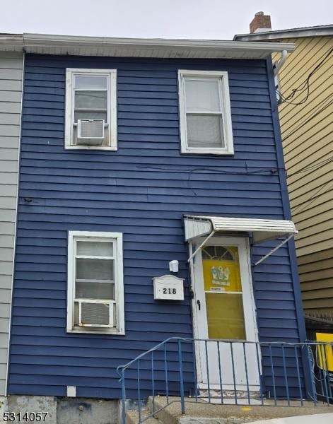 view of front of property featuring cooling unit