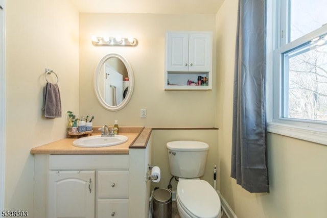 bathroom with vanity and toilet