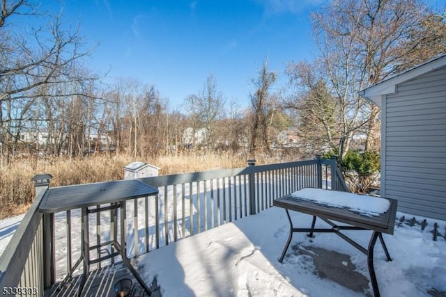 view of snow covered deck