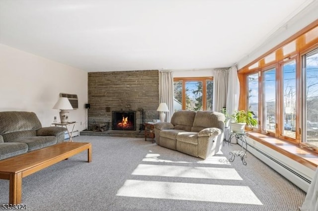 living room with carpet, a baseboard radiator, and a fireplace