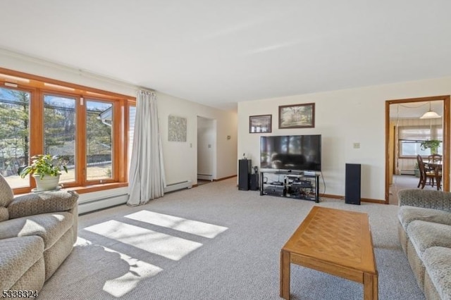 living room with a baseboard radiator, carpet flooring, and baseboards