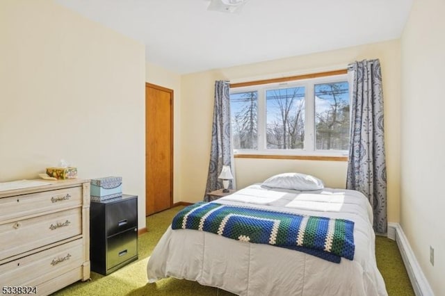 carpeted bedroom with baseboards