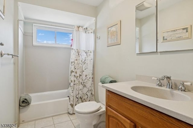 bathroom with shower / tub combo with curtain, vanity, toilet, and tile patterned floors