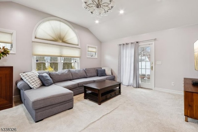 carpeted living area featuring recessed lighting, a notable chandelier, vaulted ceiling, and baseboards